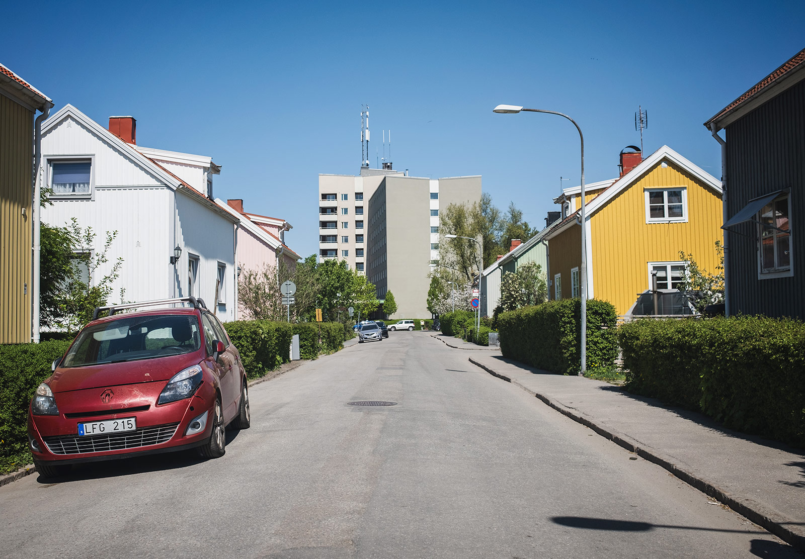 Modern apartment block between old houses