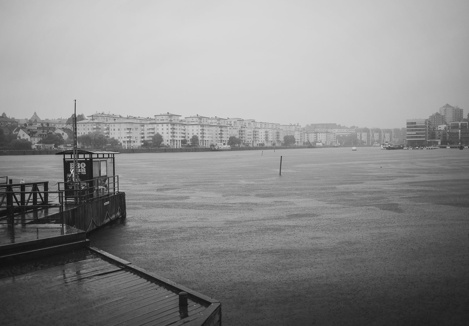 Rain pouring down on city waterway