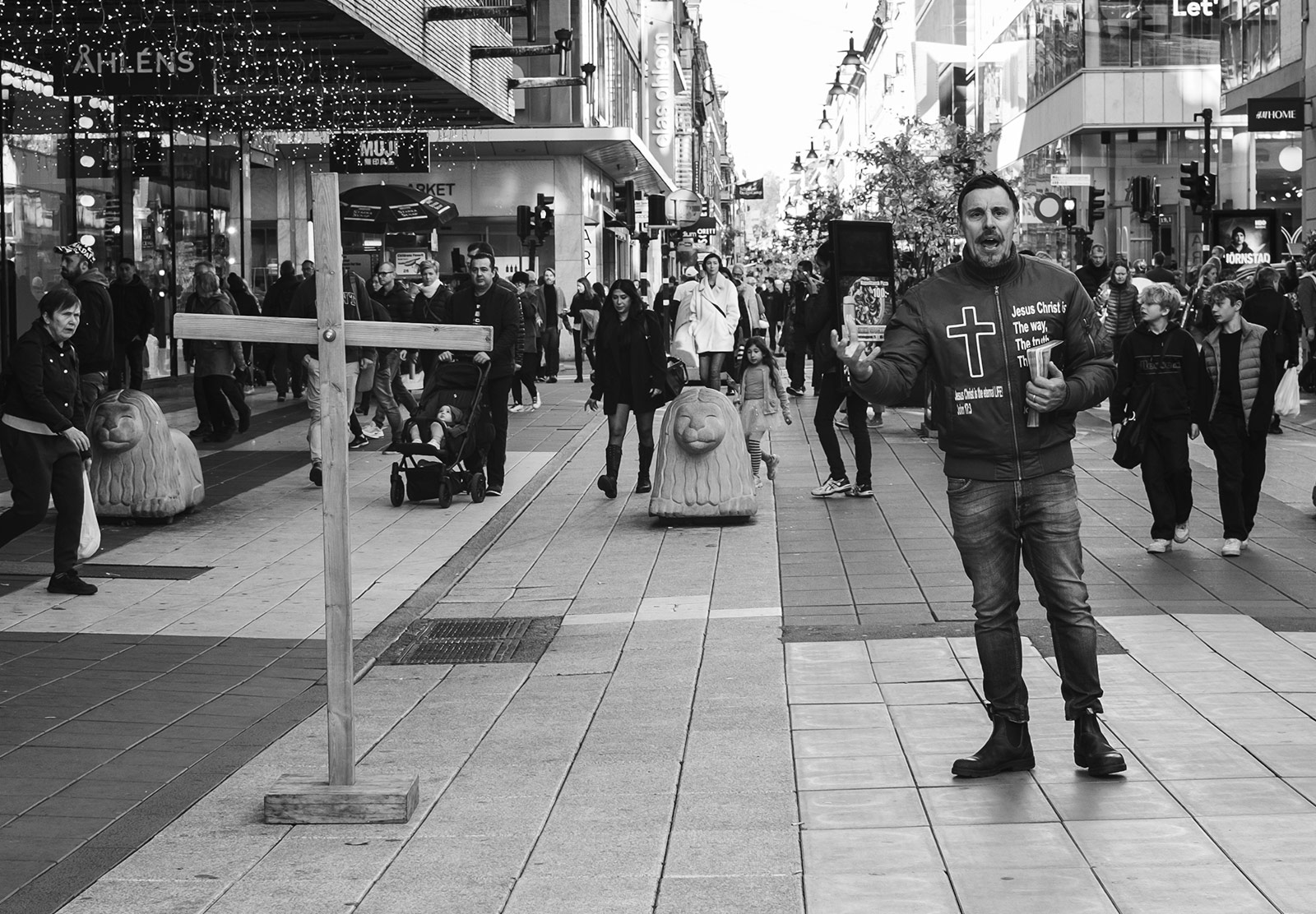 Man standing with bible and cross