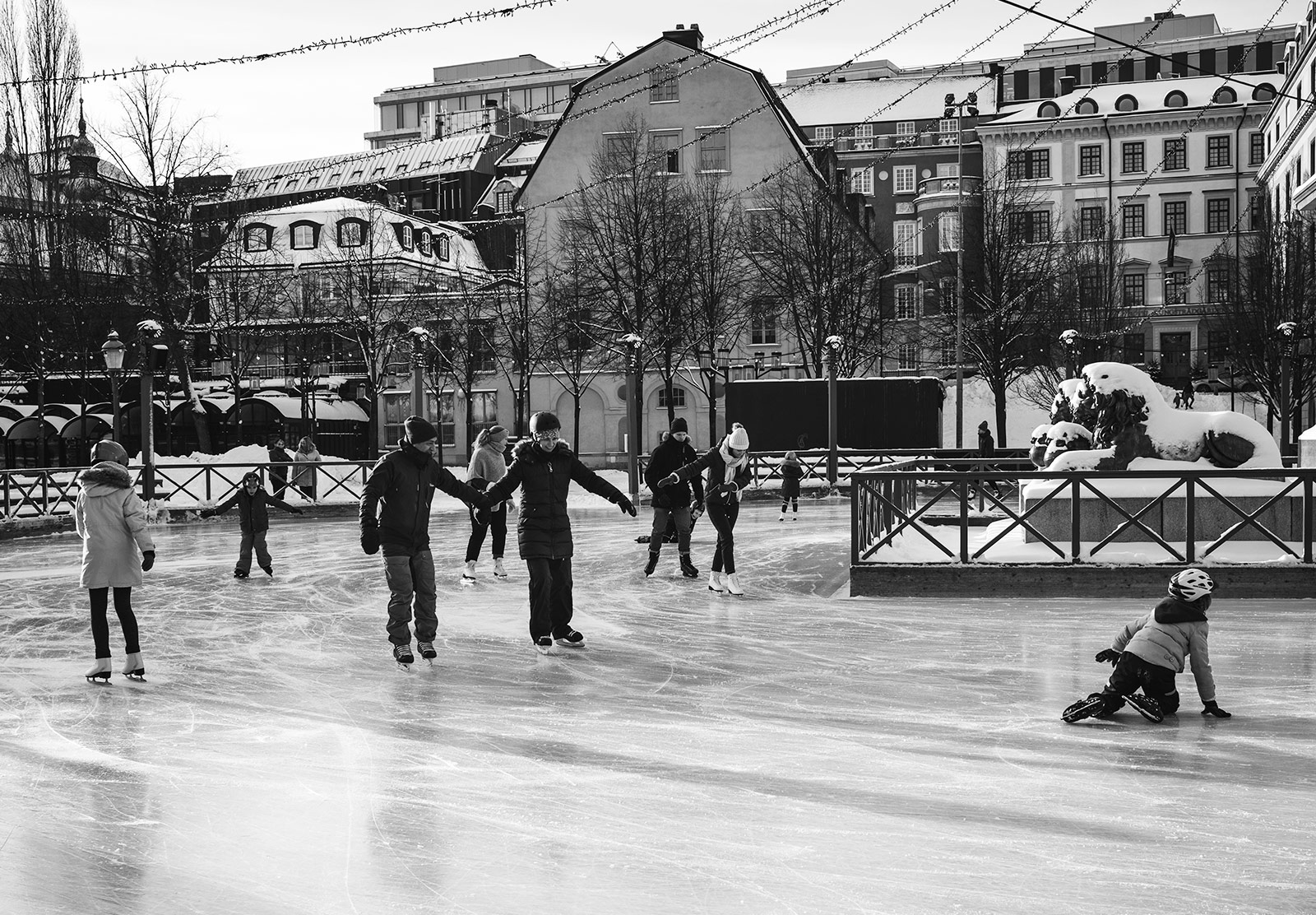 People skating on ice rink