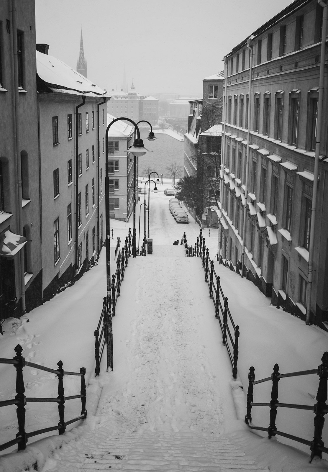 View of water down snow covered steps