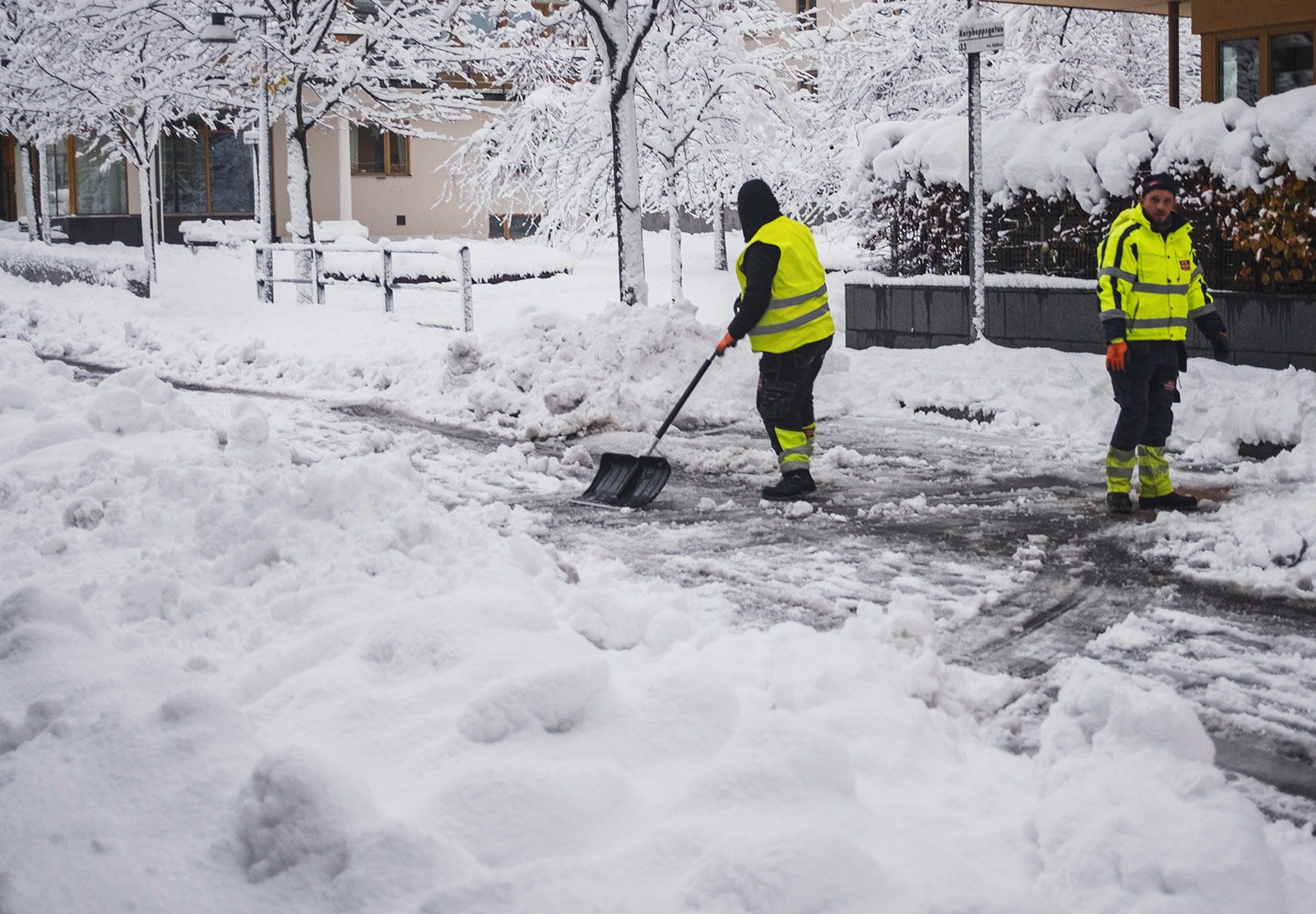 Men shoveling snow