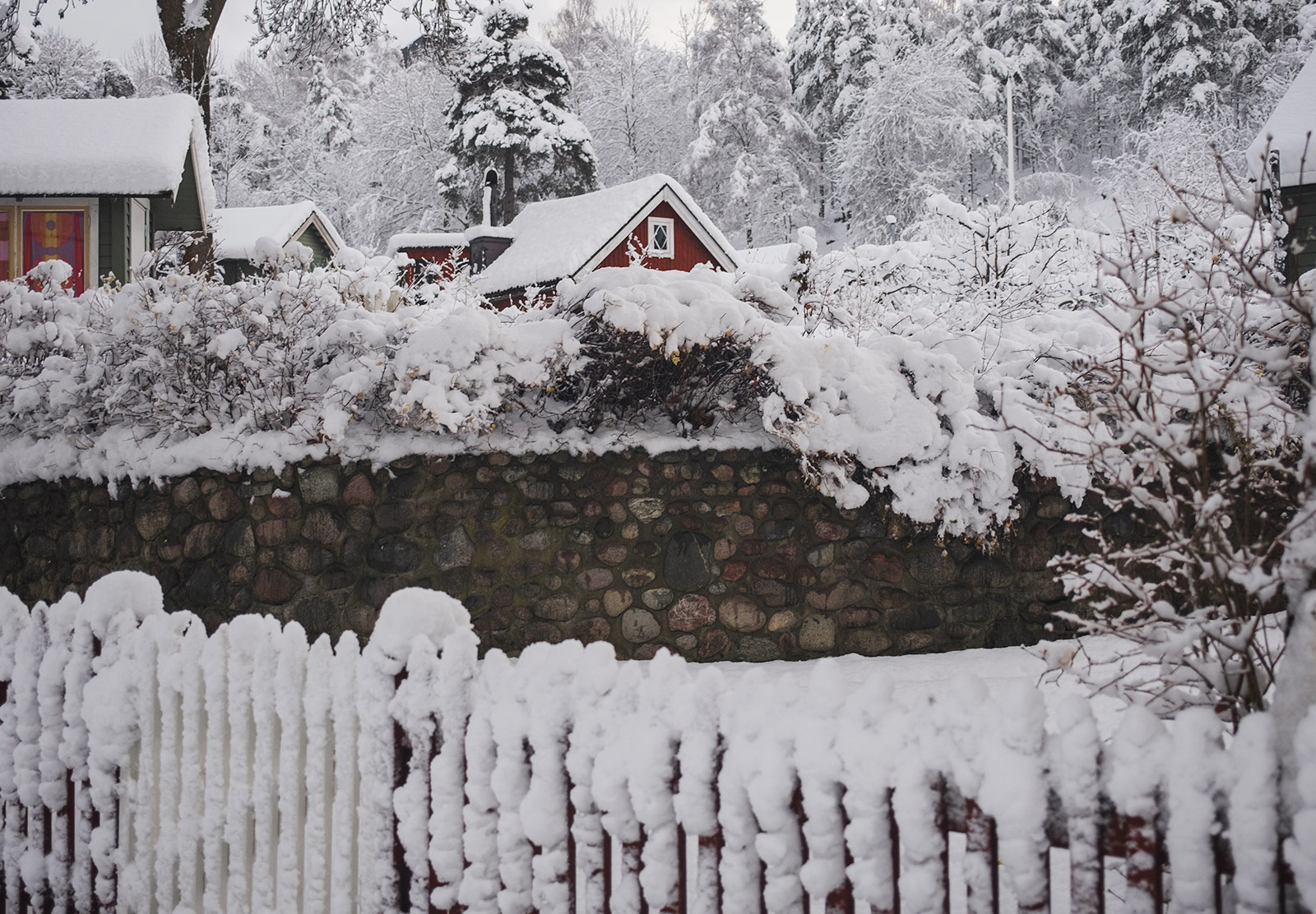 Red wooden building with snowy roof