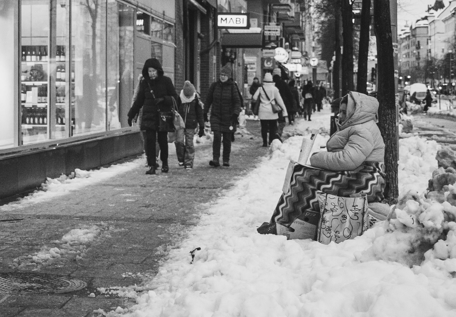Lady begging in the snow