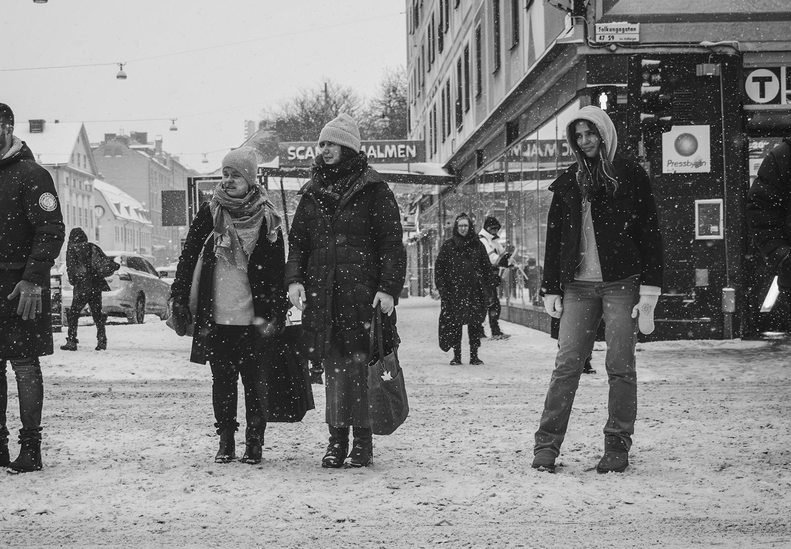 People stood at crossing in the snow