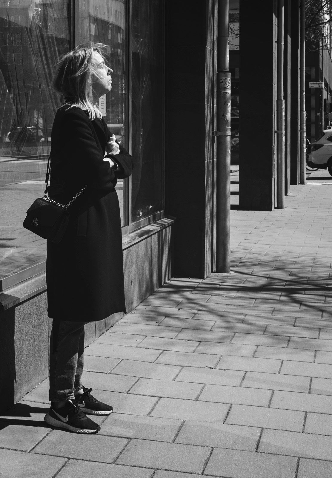 Woman with face to the sun