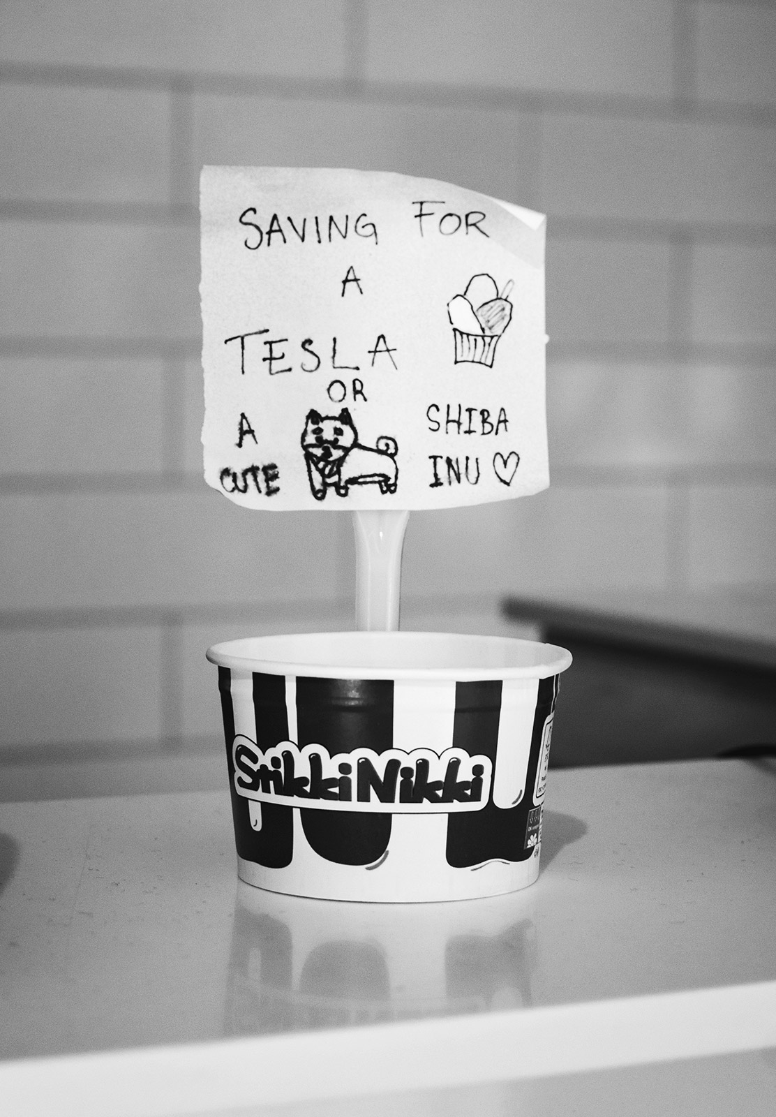 "Saving for a tesla" tip jar