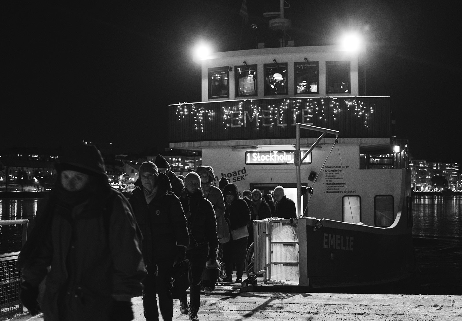 People walking off boat