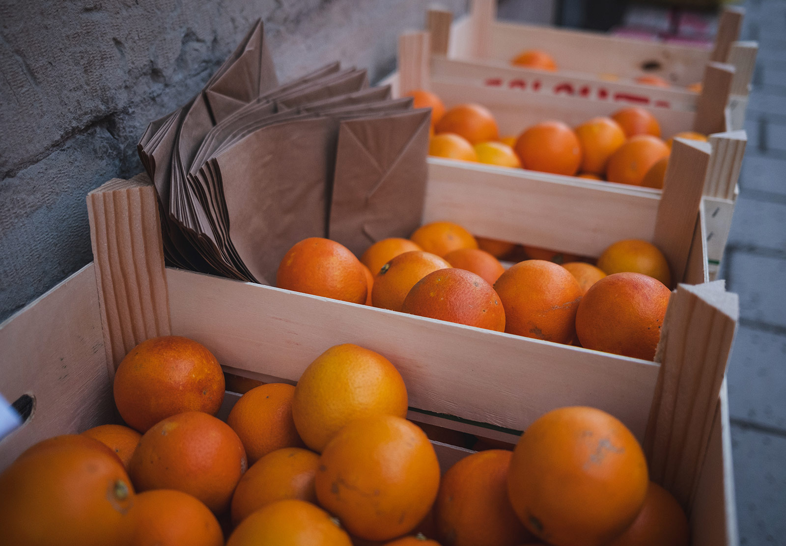 Oranges in wooden crates on the street
