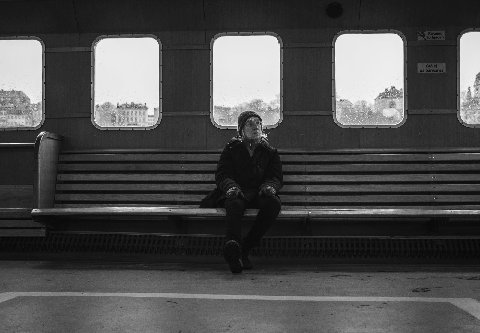 Woman sat alone on bench