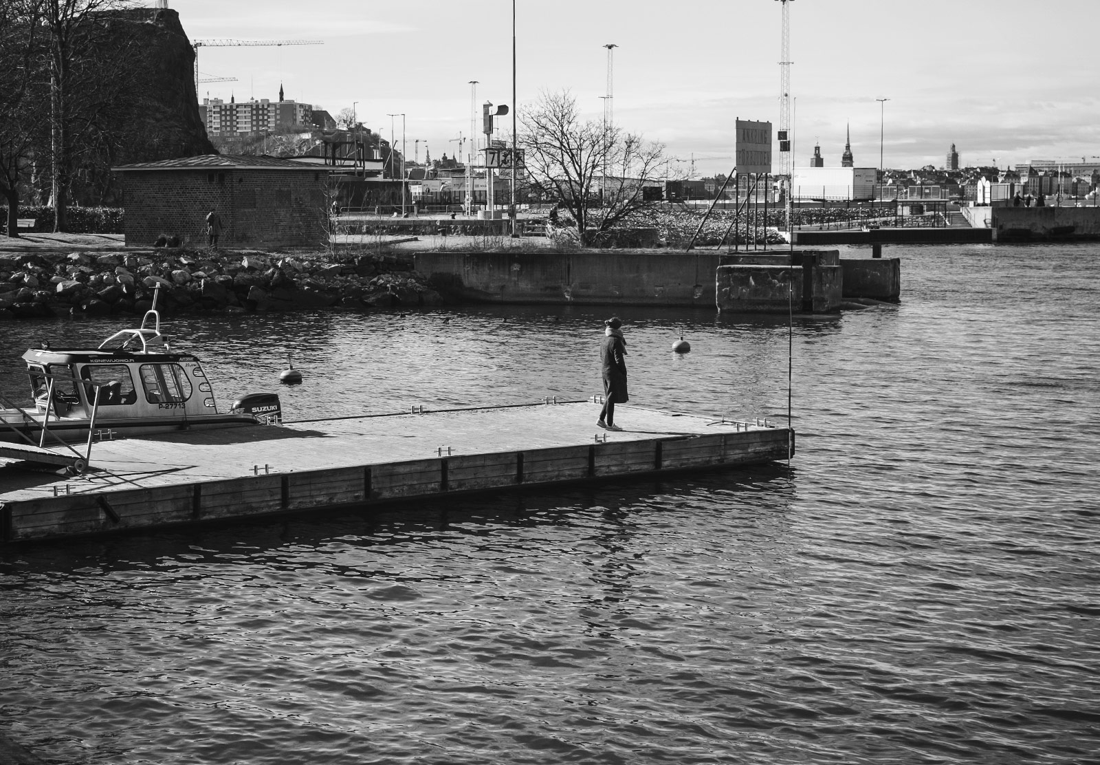 Woman waiting for a boat