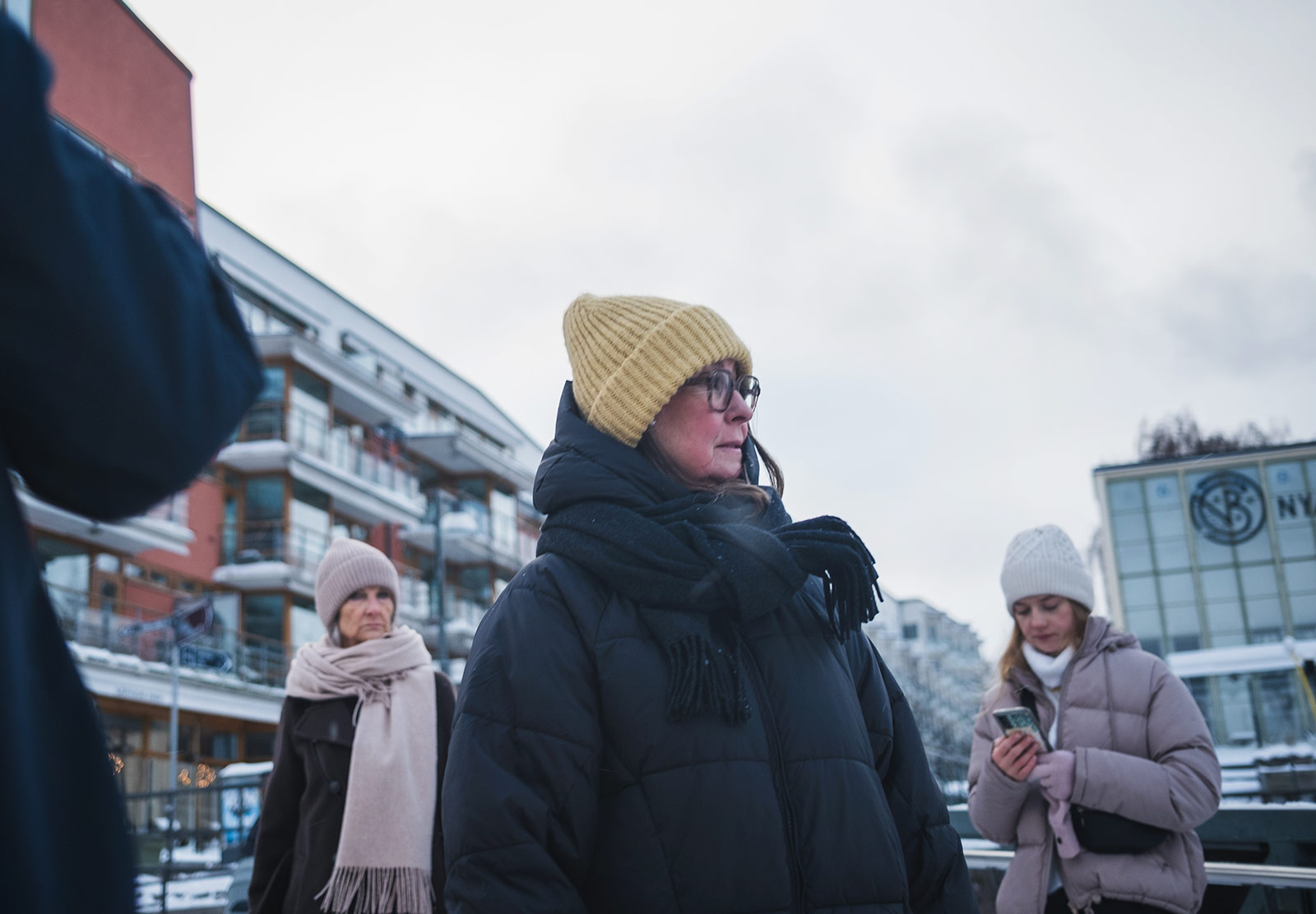 Woman wrapped in coat, scarf and hat