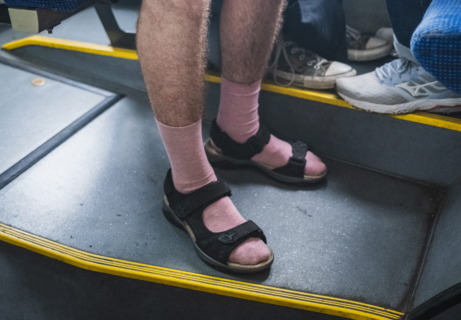 Man wearing socks with sandals