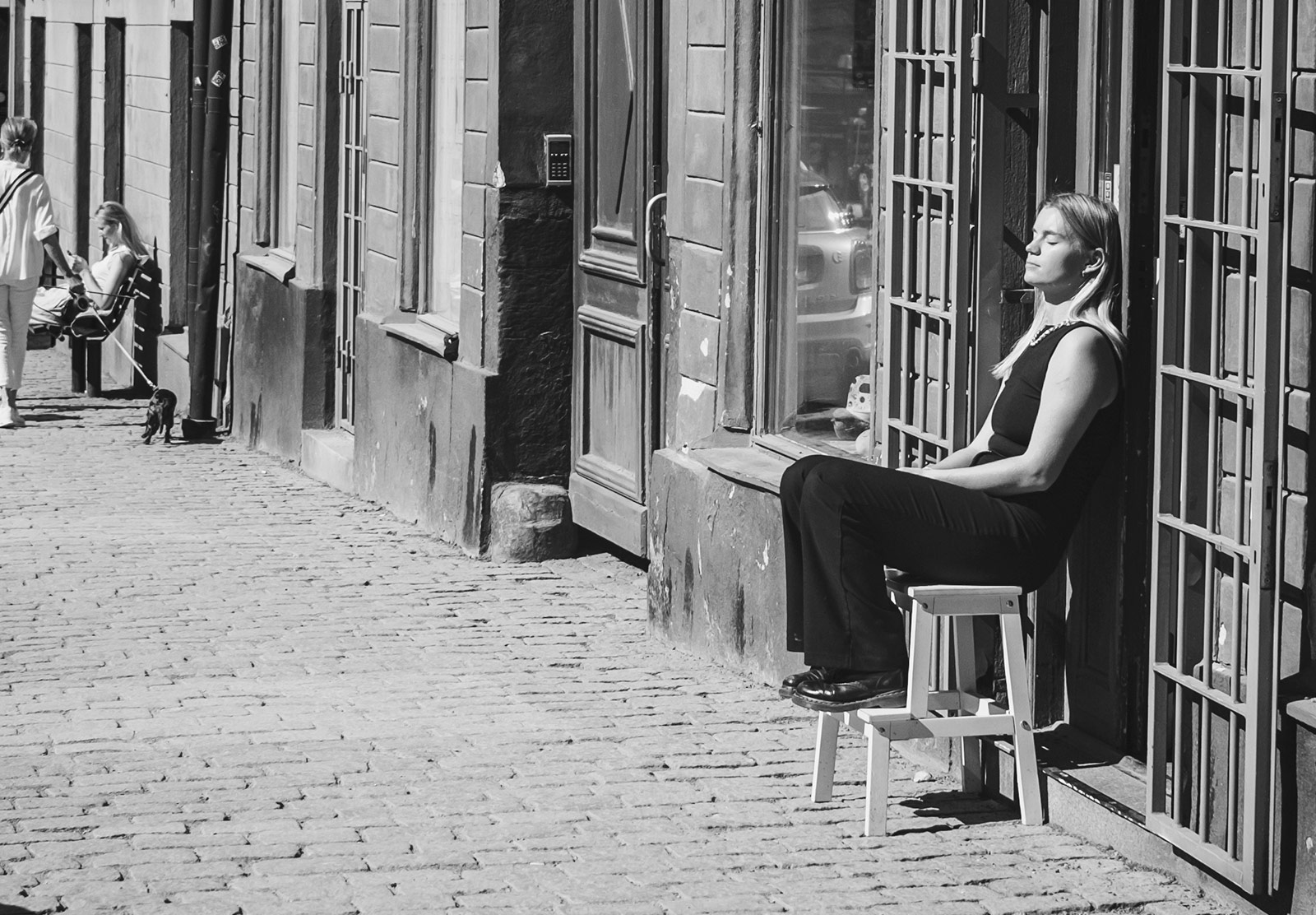 Lady sitting in the sun with her eyes closed