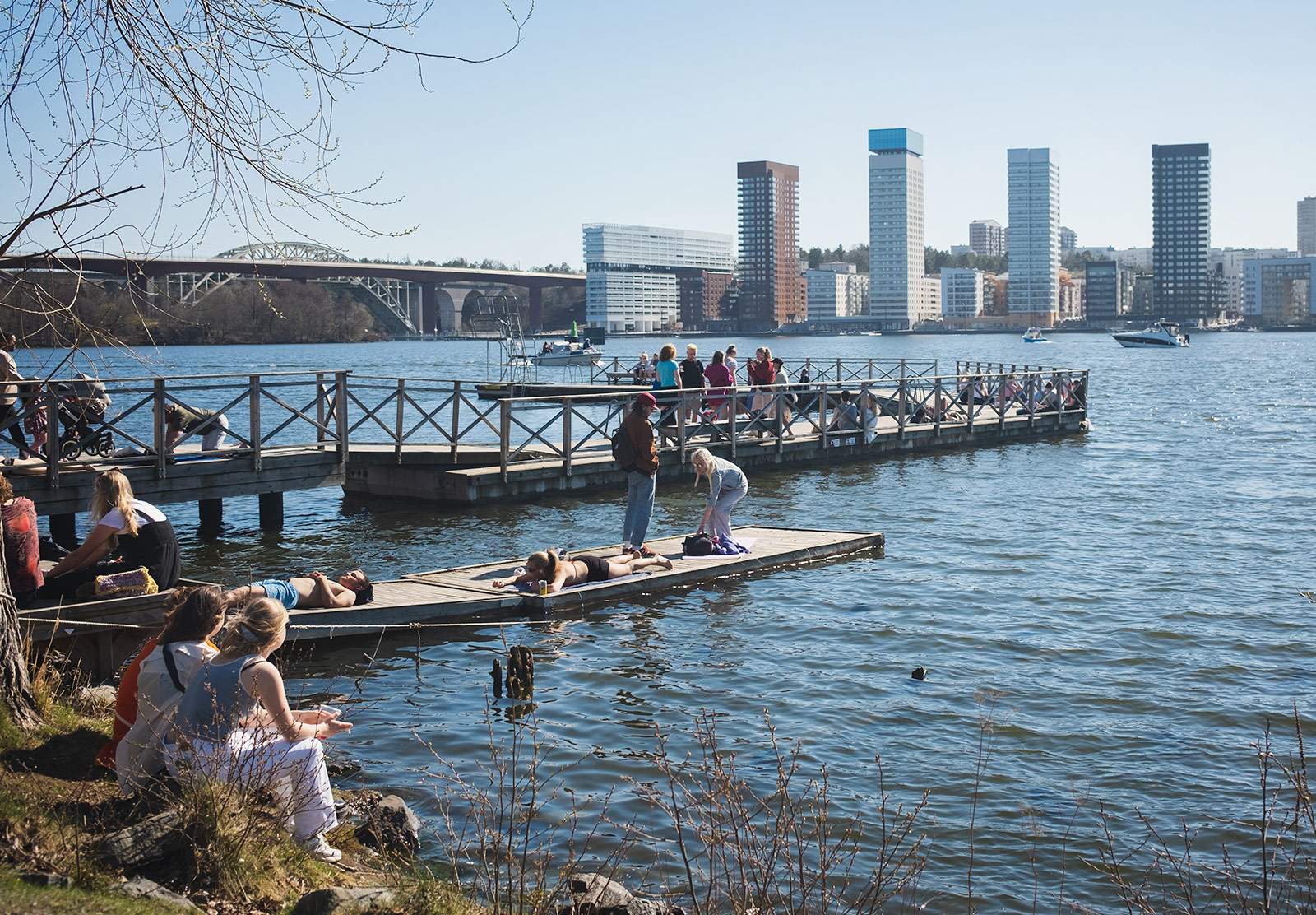 People laying on jetty in the sun