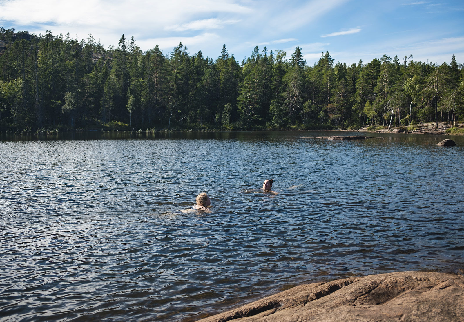 Woman swimming in lake