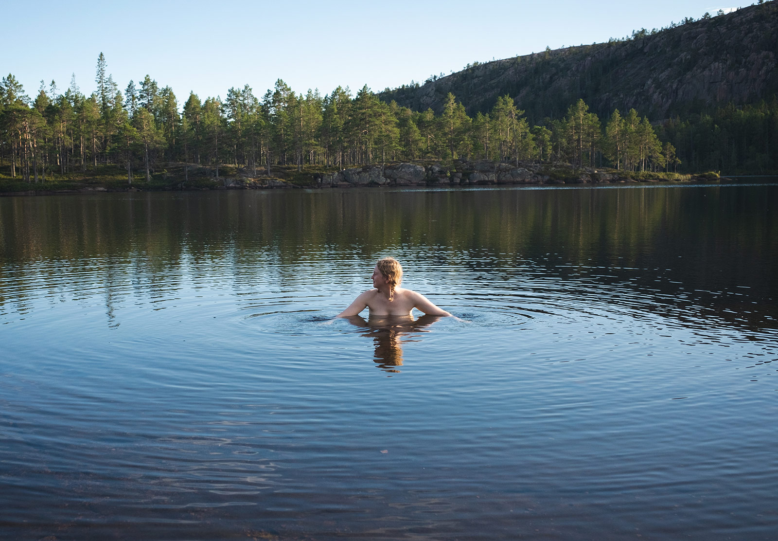 Woman swimming in lake