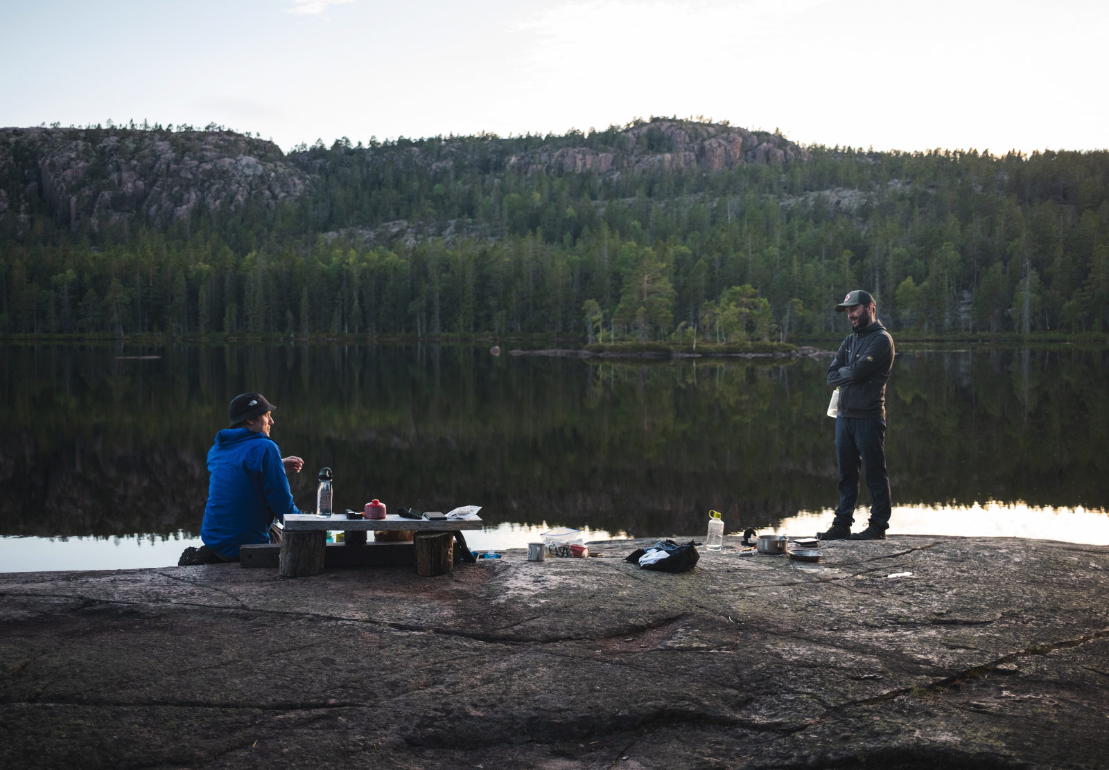 Men next to lake