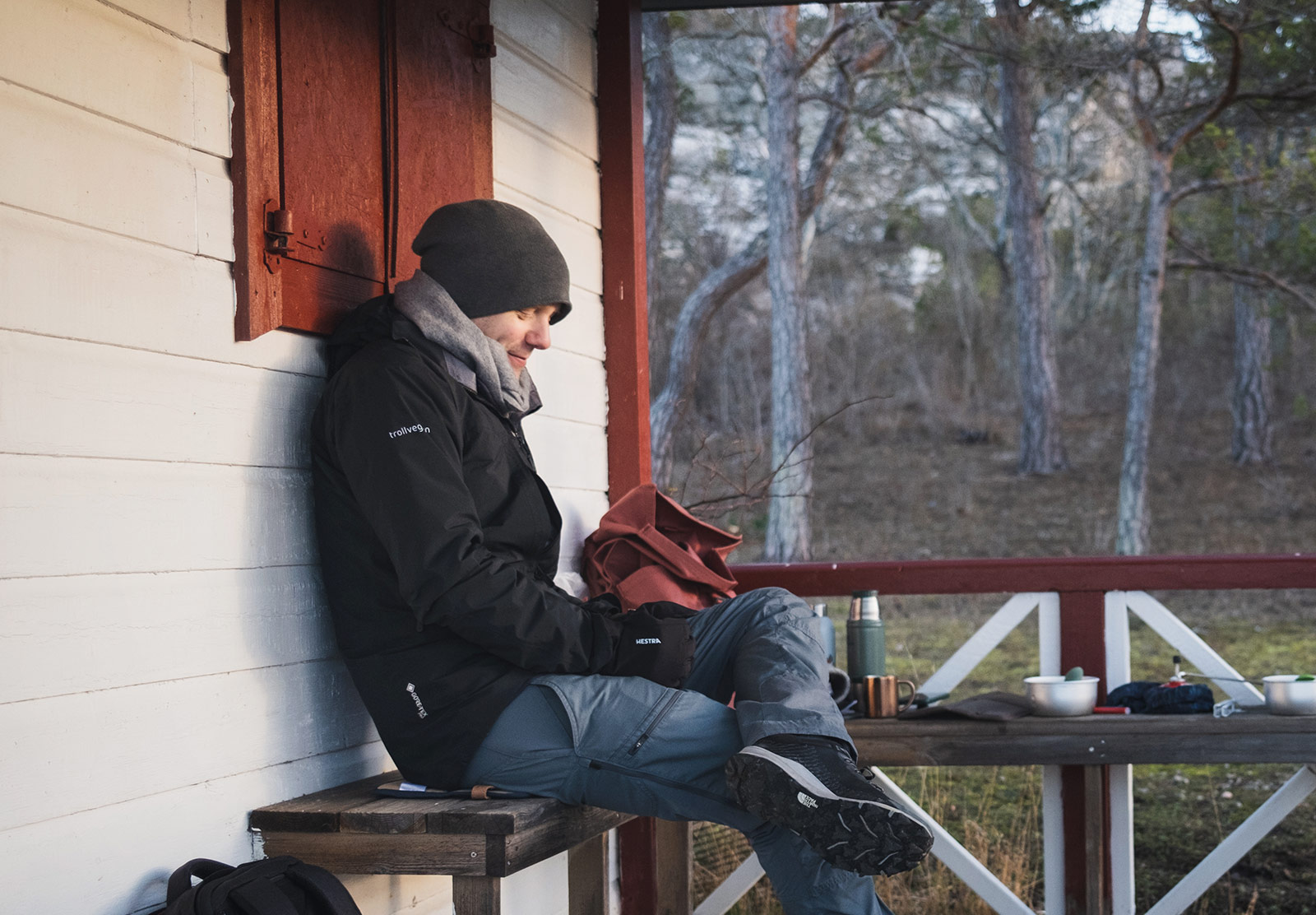 Man sat on bench with tea