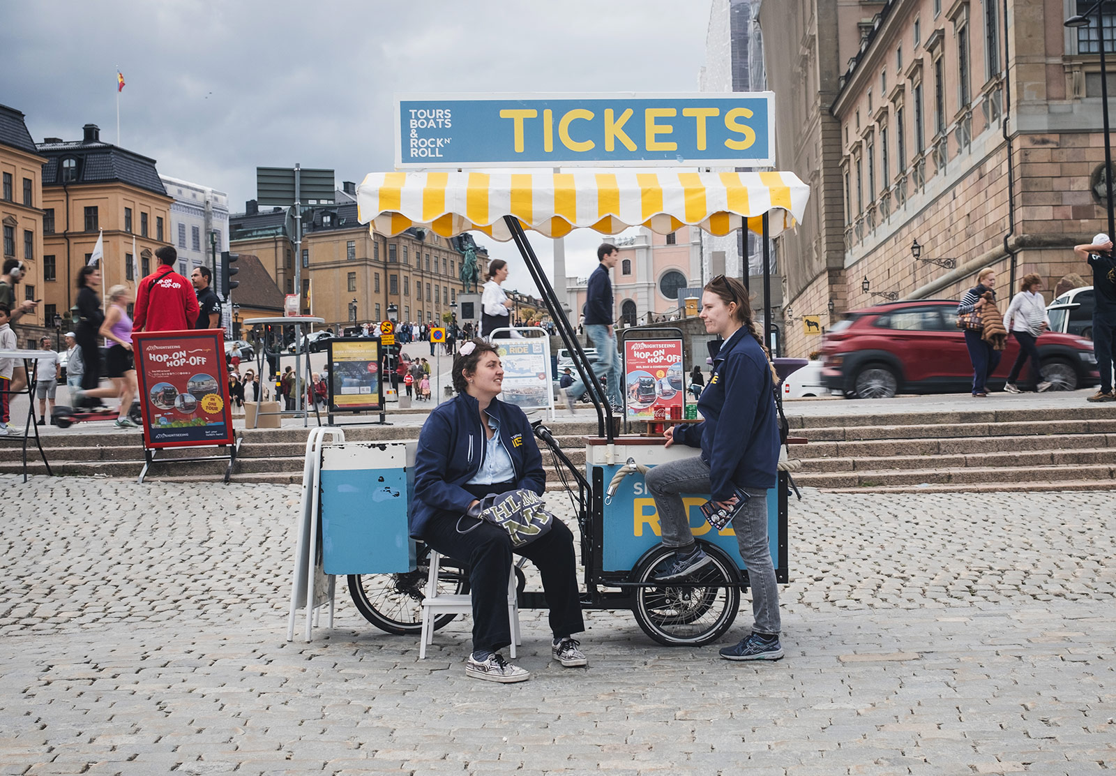 Woman sat on ticket trolley