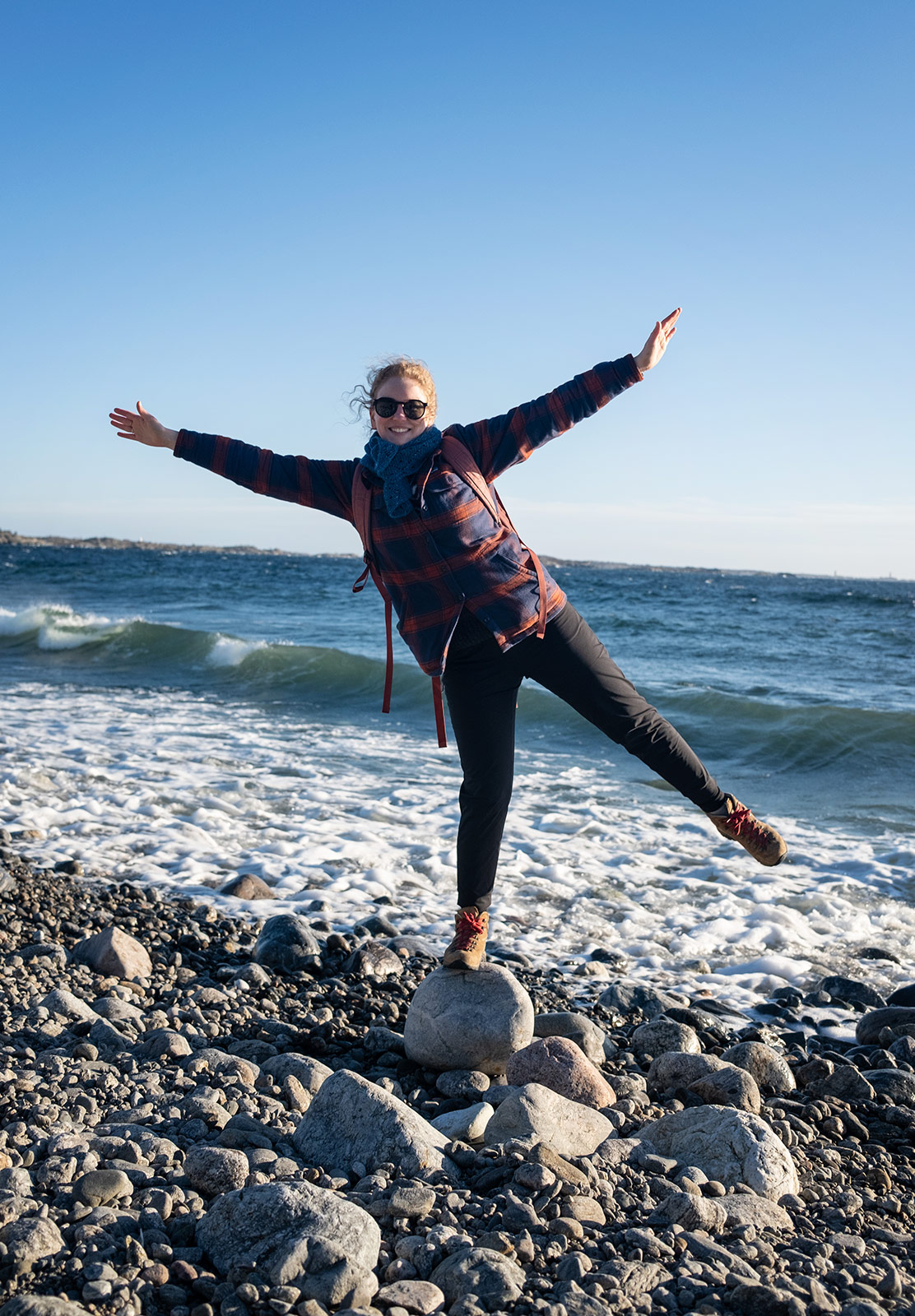 Woman balancing on rock
