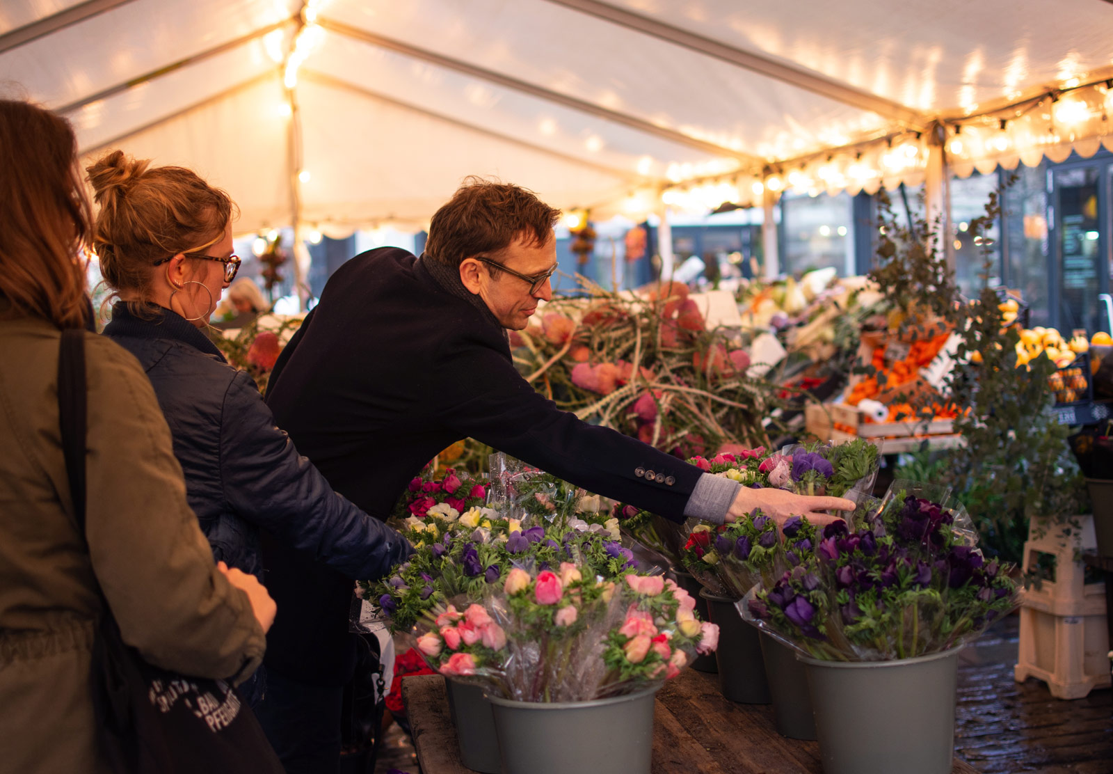 Man reaching for flowers