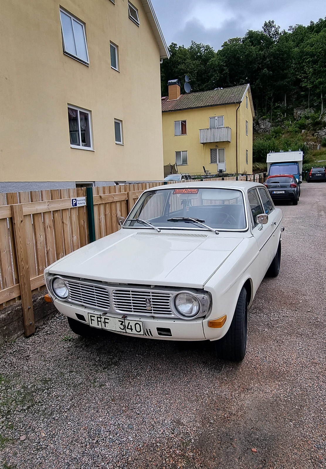 Old car parked in drive way