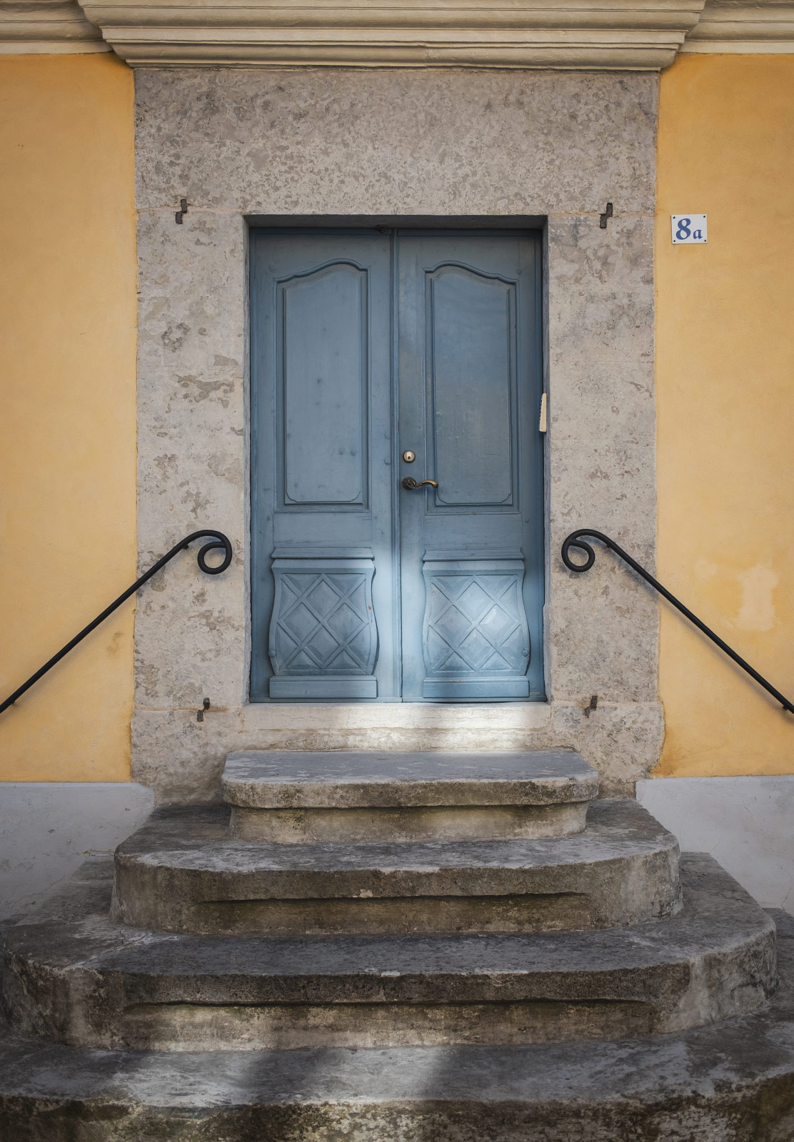 Blue door on yellow building