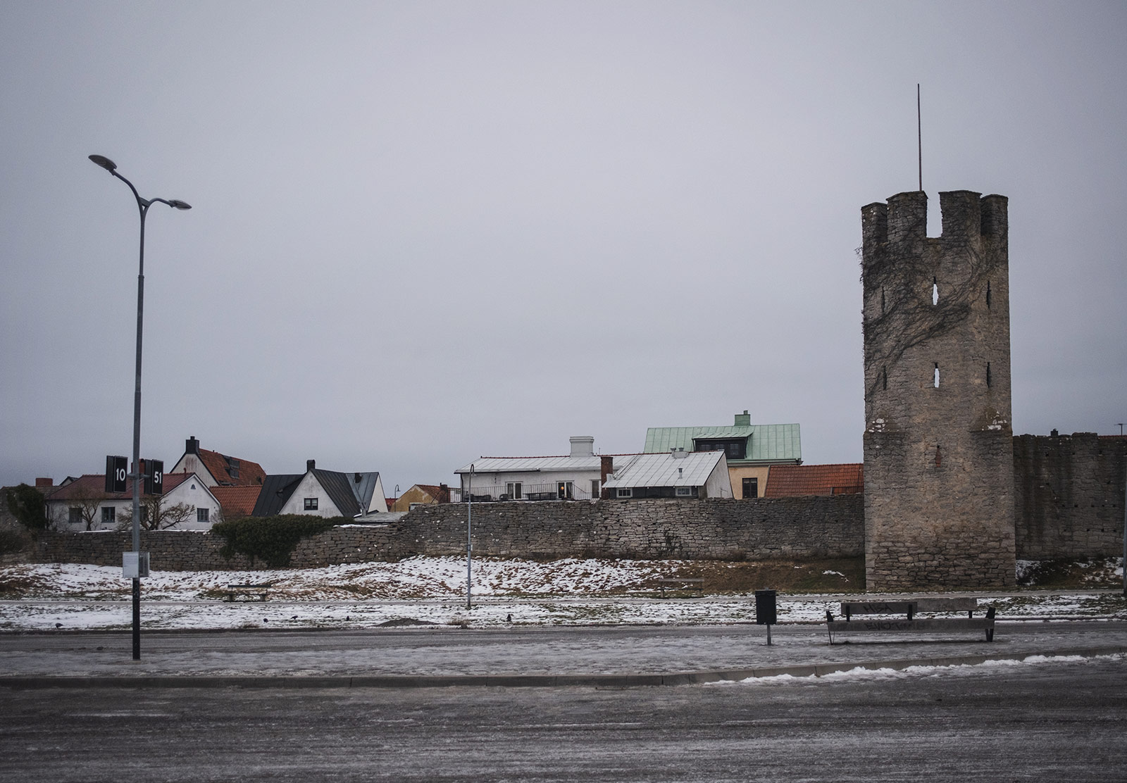 Rooftops above old wall
