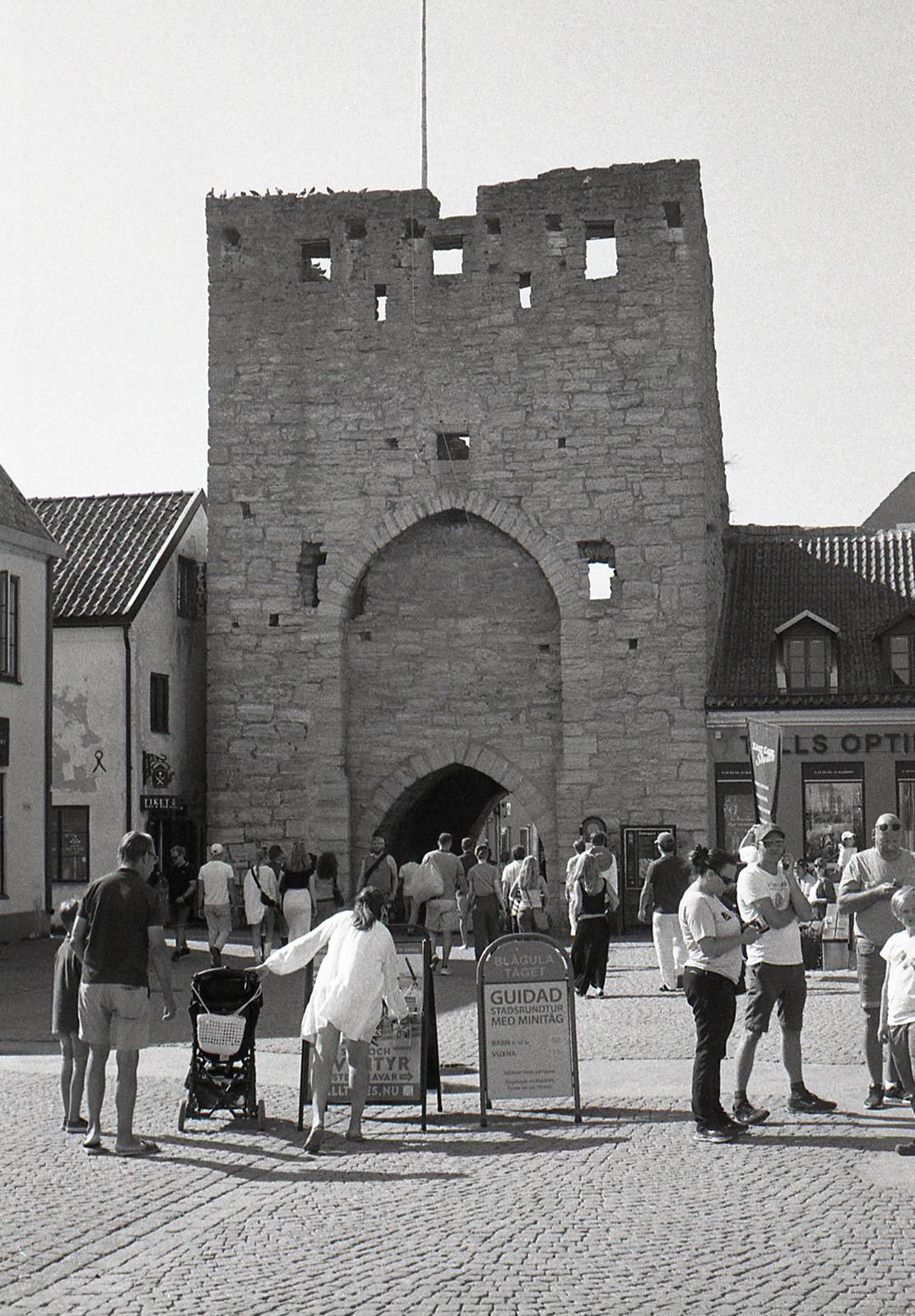 People by medieval wall