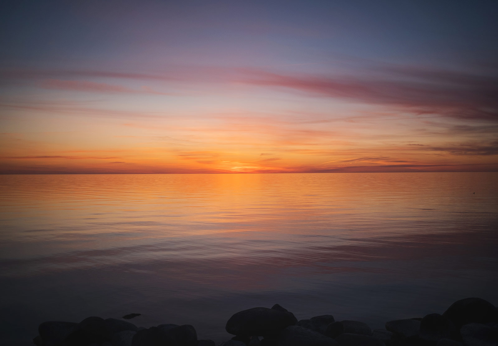 Sun sitting at horizon level