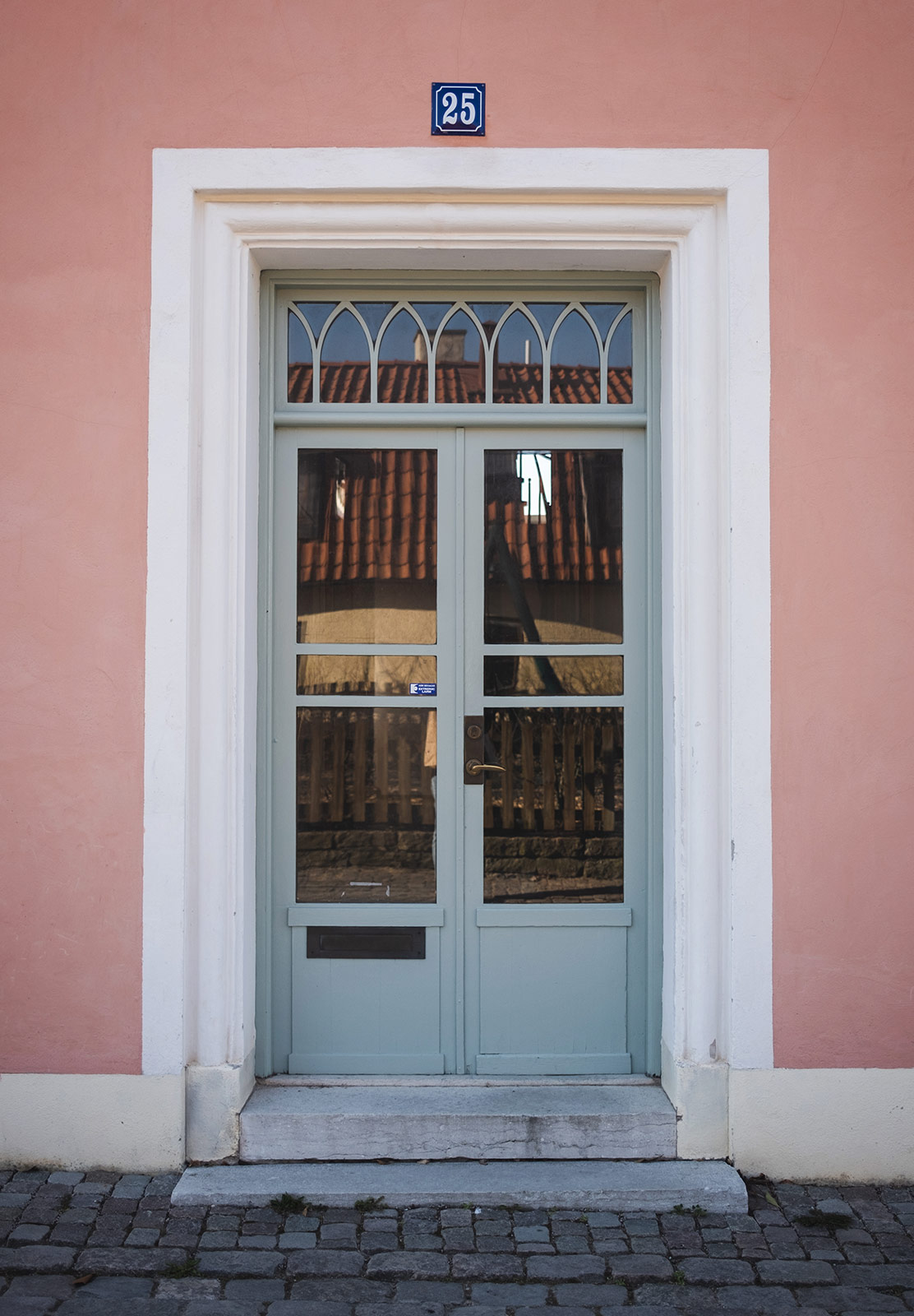 Blue door in pink building