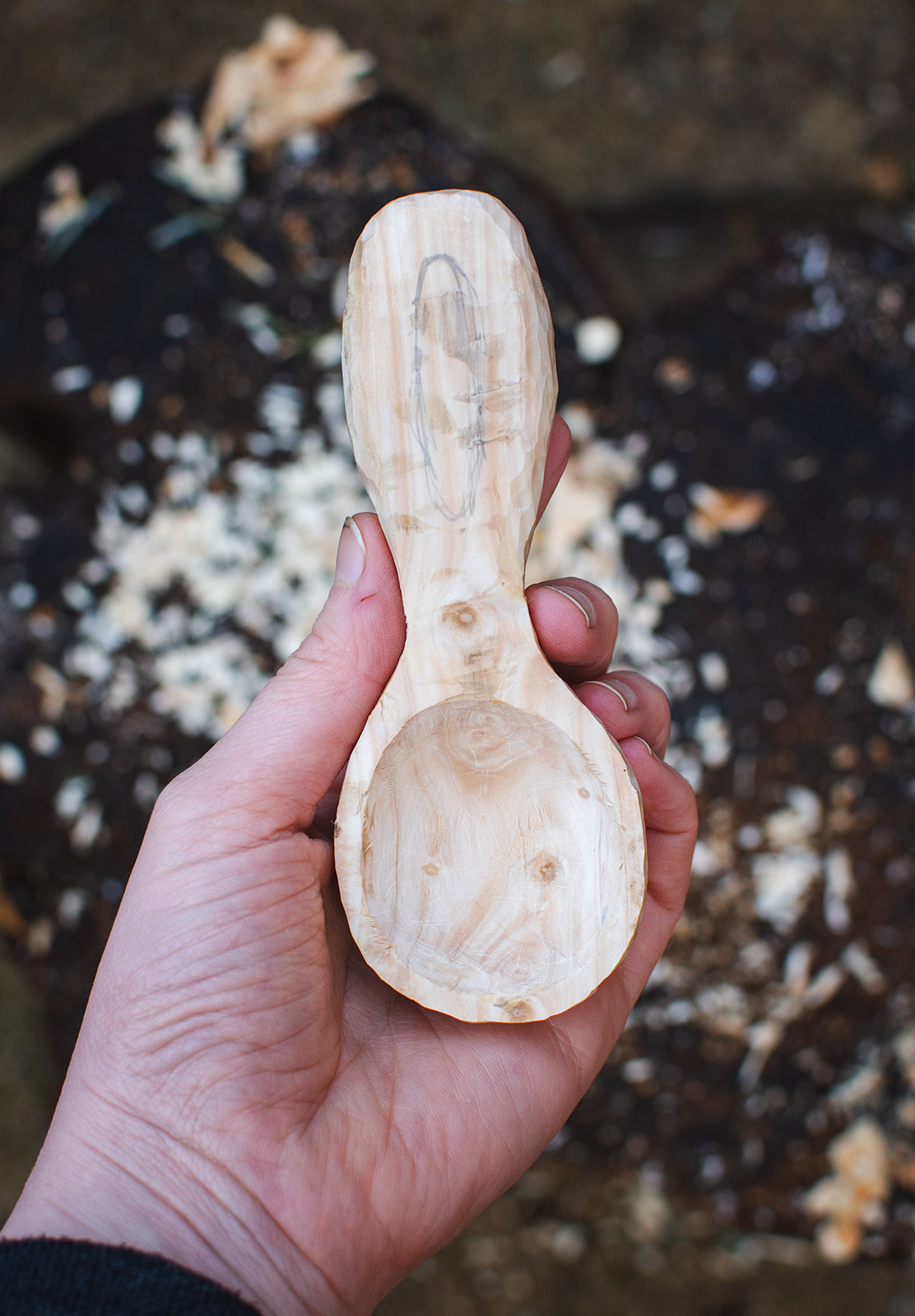 Carved spoon in hand