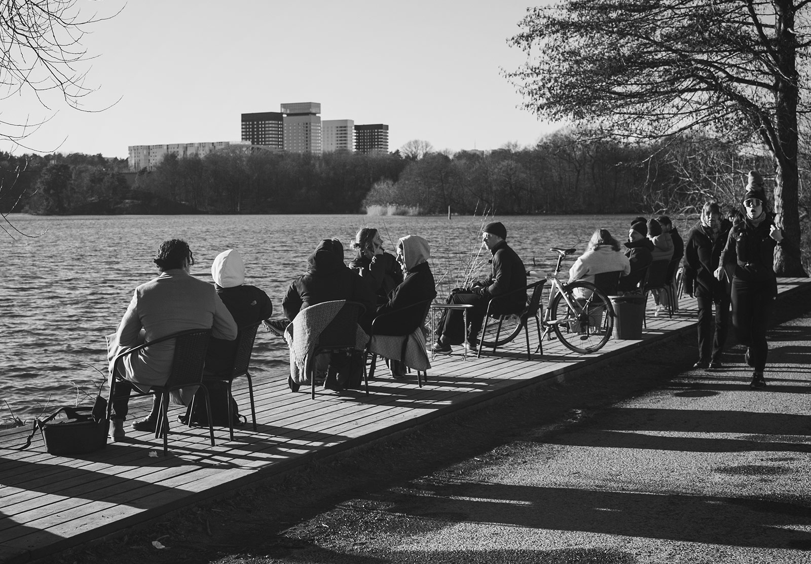 People sat outside in coats