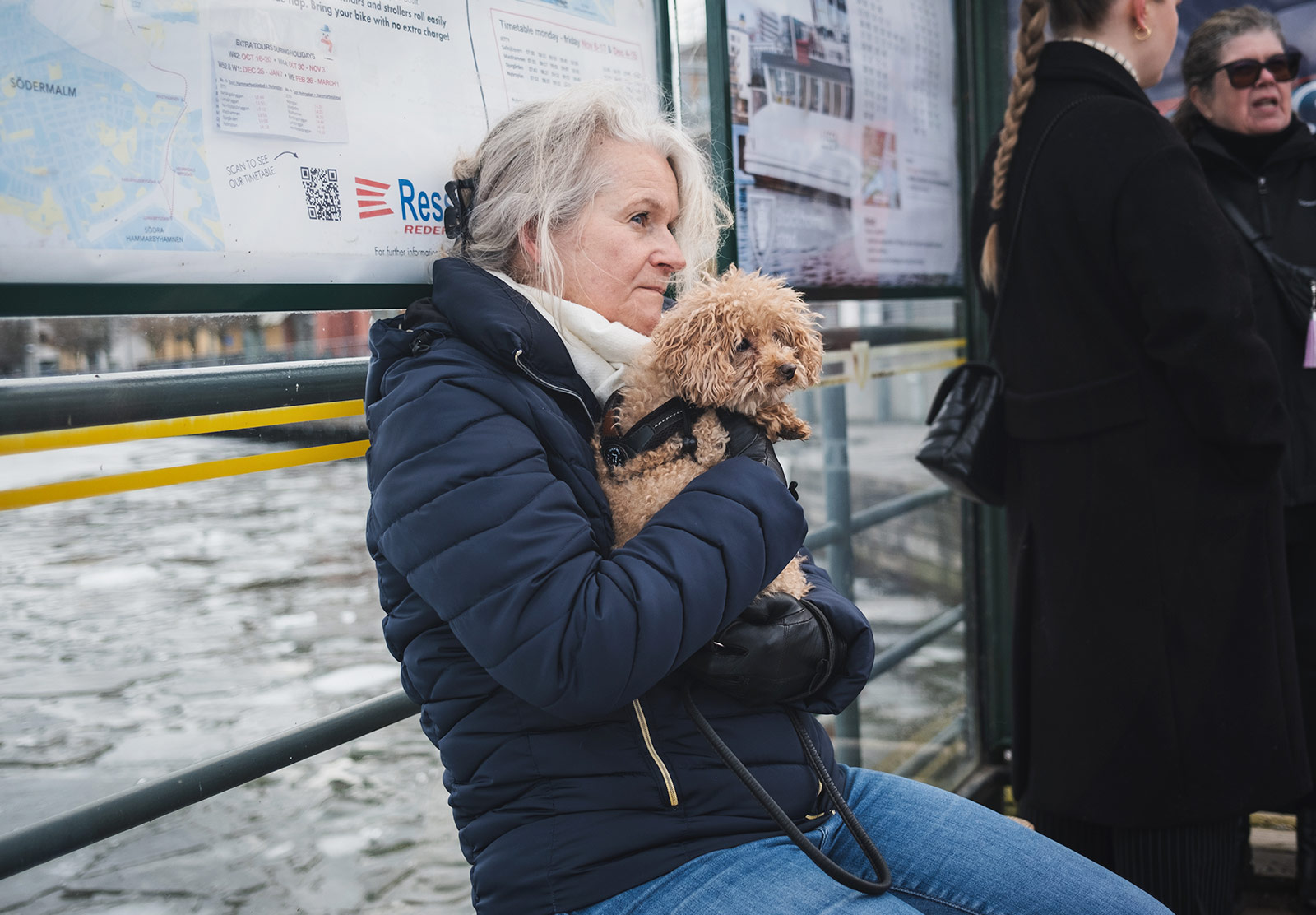 Woman cuddling dog