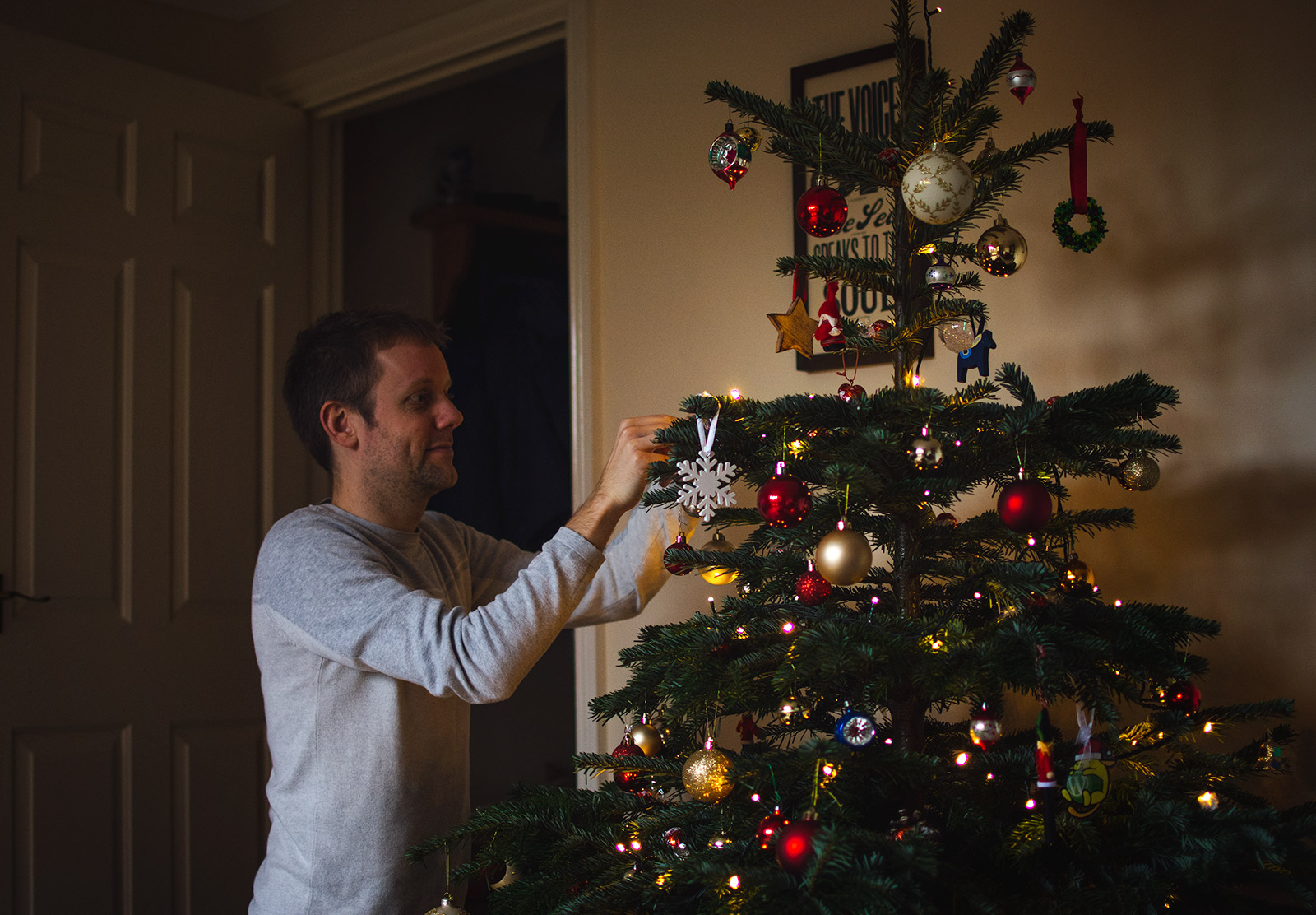 Man decorating tree