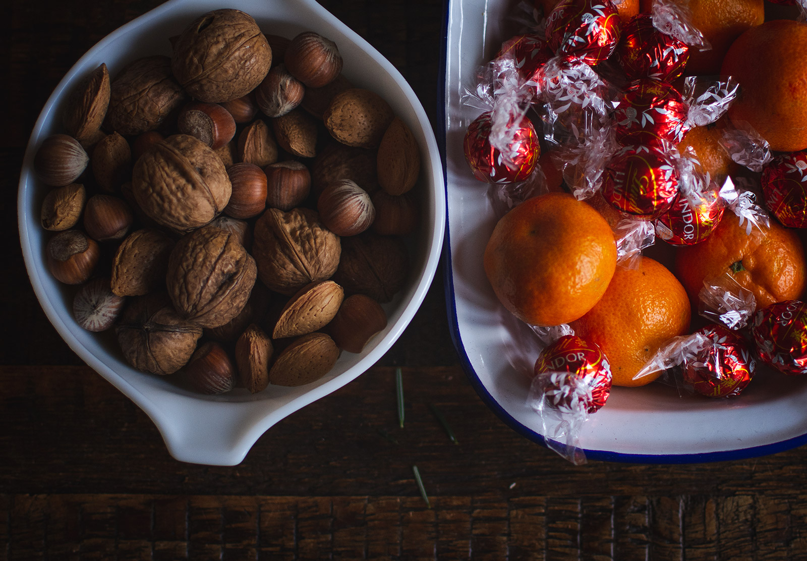 Bowls of nuts and satsumas