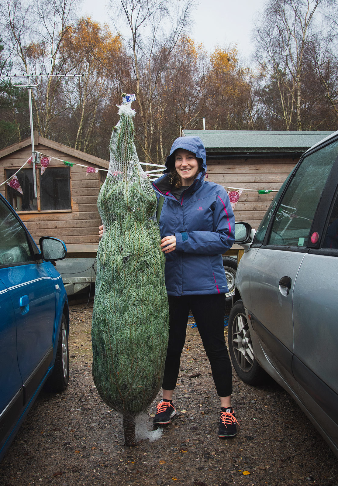 Standing with Christmas tree