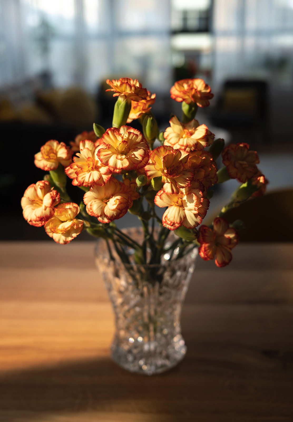 Vase of yellow flowers