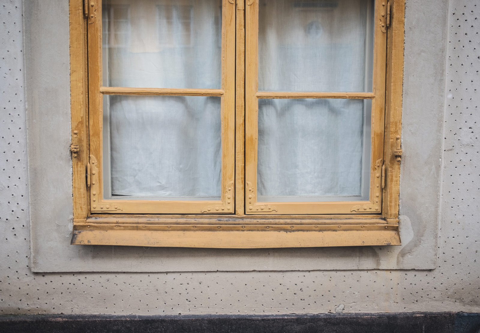 Painted, ornate window frame