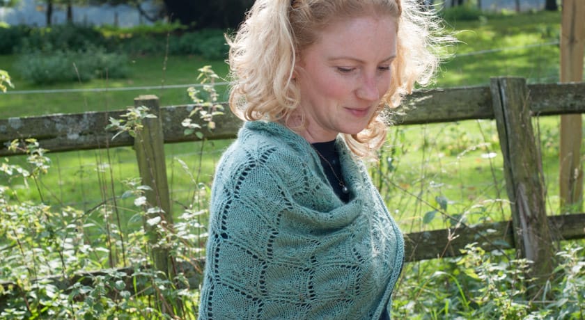 Wrapped in green wool shawl