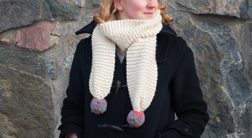 Knitted pompom scarf