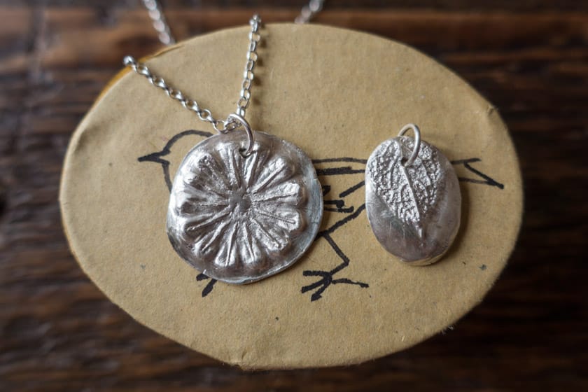 Silver pendant on box