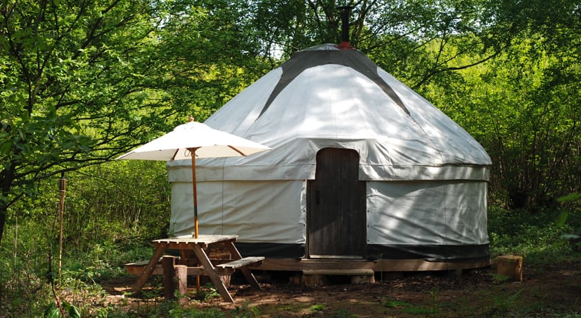 Yurt and wooden picnic table