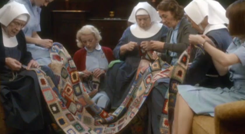 Nuns and midwives sewing a blanket