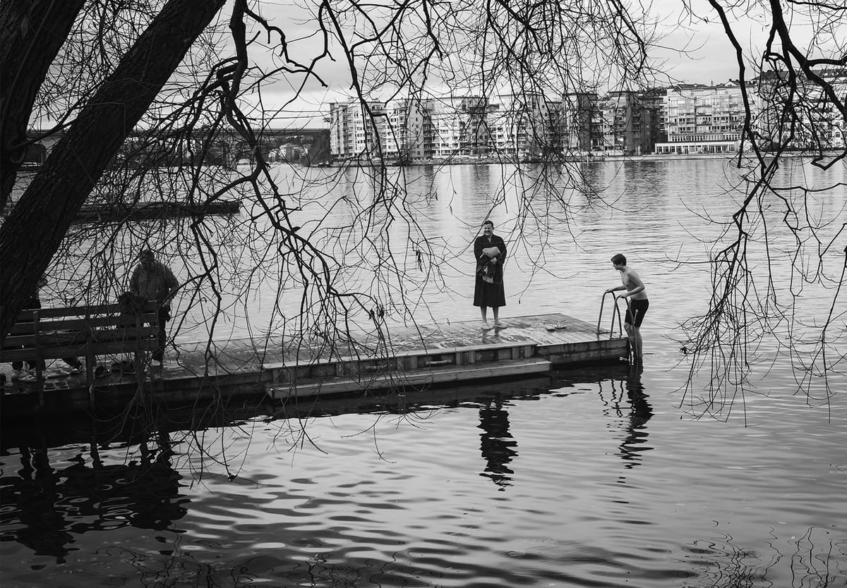 Boy stepping into water