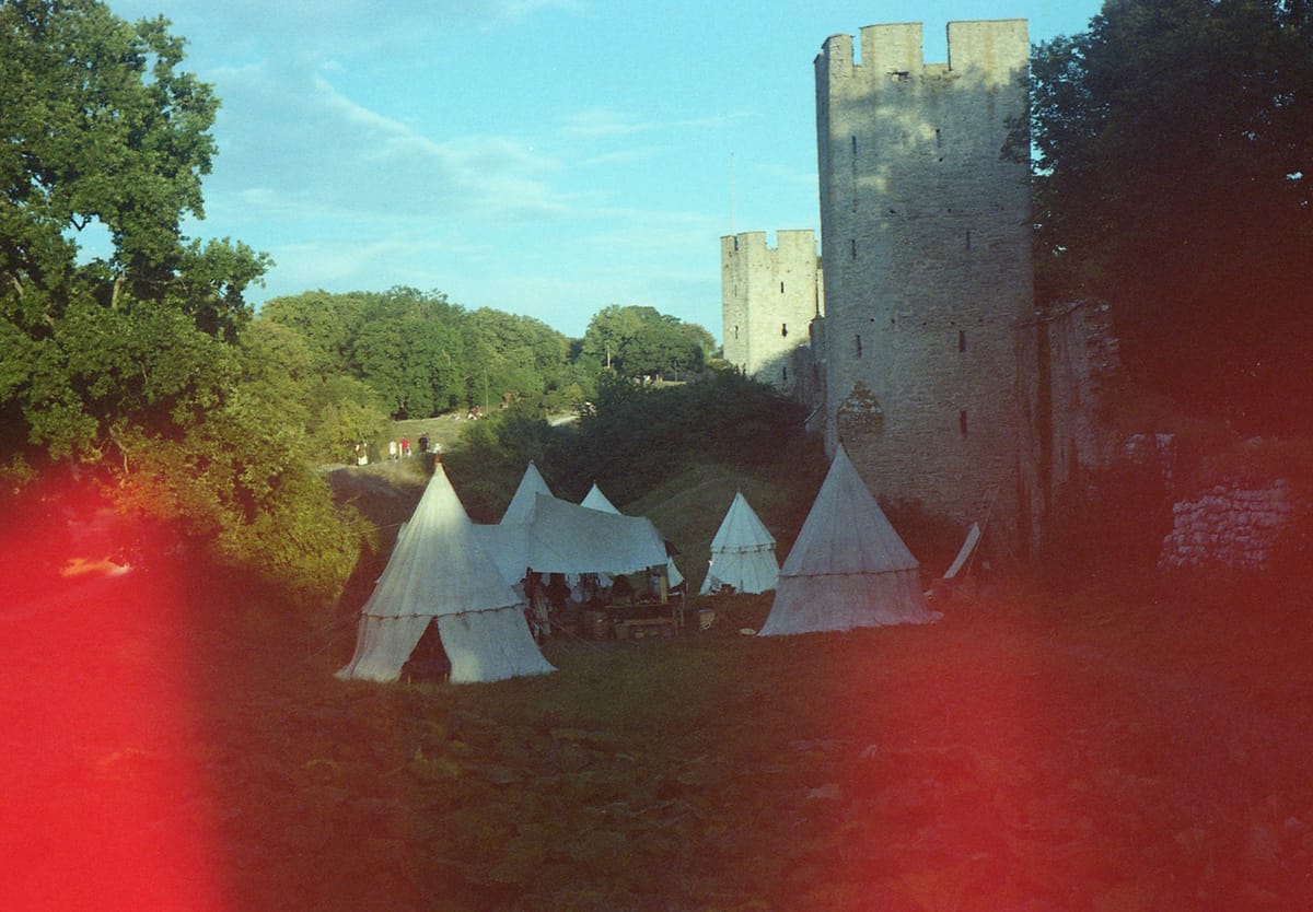 Medieval tents next to ruins