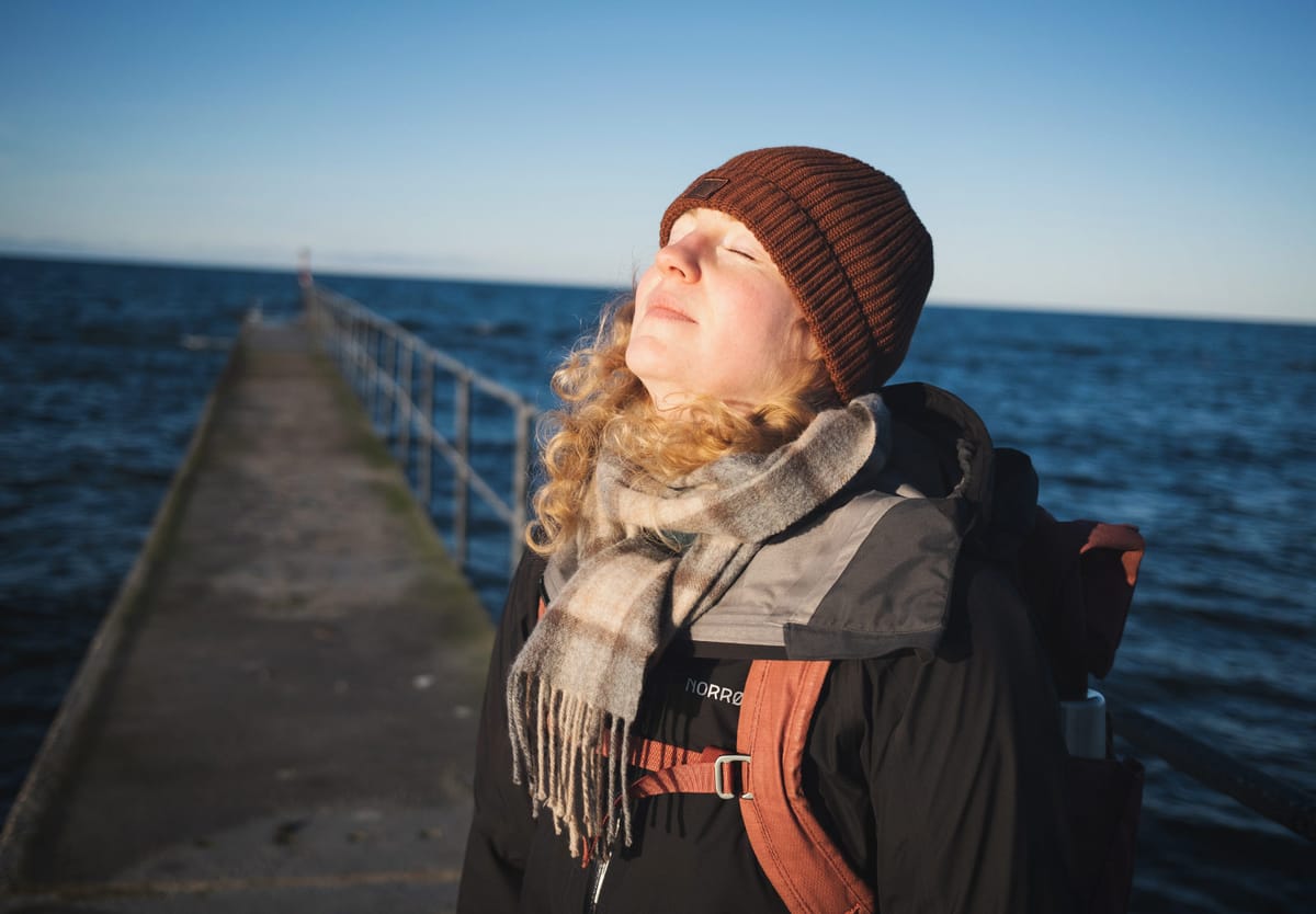 Woman with sun on her face
