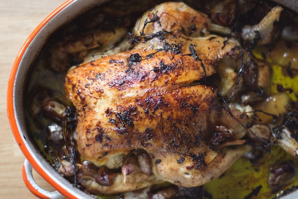 Roasted chicken in roasting pan