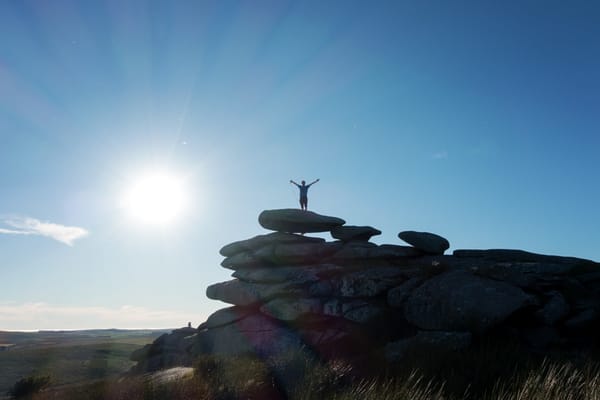 Person on top of rock stack